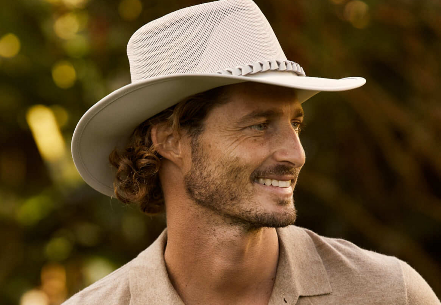 Man smiling in Aussie Golf mesh wide brimmed hat