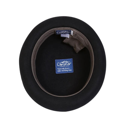 Inside view of wool bowler/derby hat in color Black with a braided Black and Brown band and brass colored emblem showing the organic inner band and secret pocket