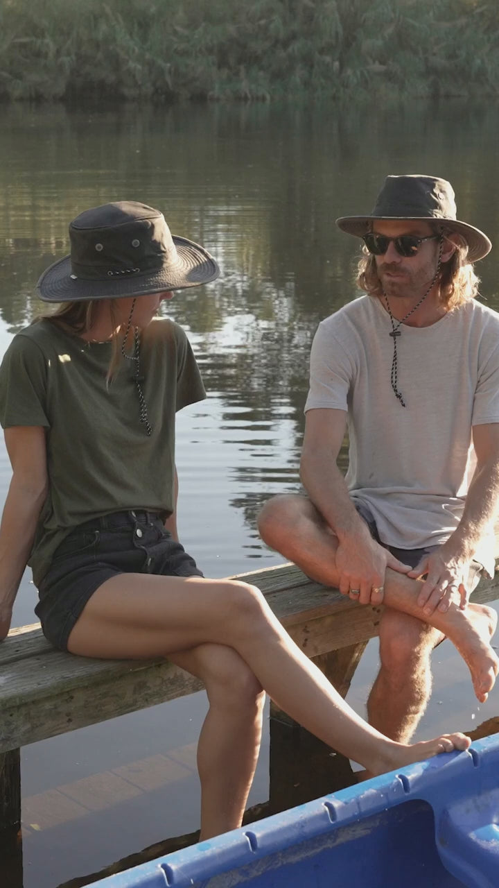 Murchasin River water resistant boating hat on the river