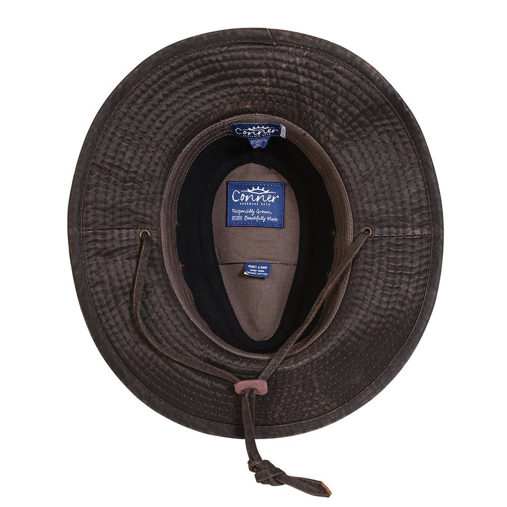 Inside view of wide brim sun protection cloth outback outdoor hat with chin cord showing organic cotton inner band and secret pocket