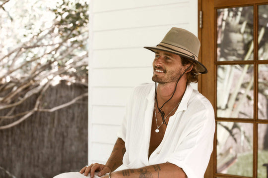 Man outside wearing Hemp mesh hiking hat with chin cord