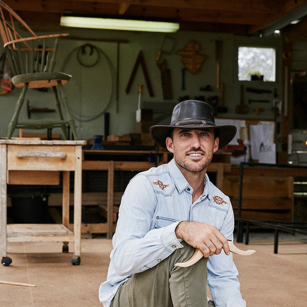 Man smiling in Conner Hats Kangaroo Crossing Australian outback leather hat in color brown with wide brim