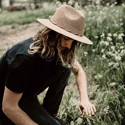 Man with long hair in garden wearing straw Boho hat with two toned rope style hat band