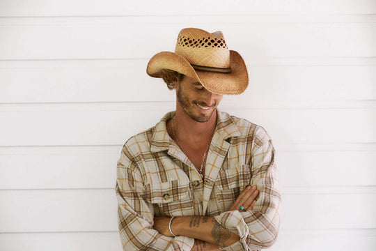 Man smiling wearing Conner hats John Dear Straw western hat with shapeable brim and vented crown for air flow