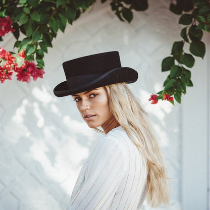 Girl with long blonde hair wearing wool top hat in color Black with shorter crown
