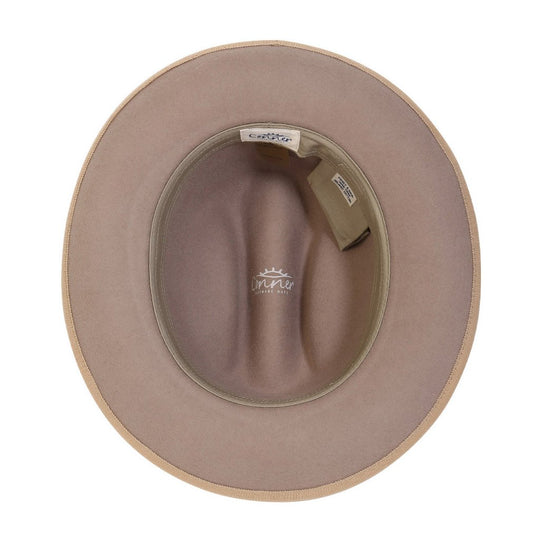 Inside view of cattleman shaped western wool hat in Putty color showing inner organic cotton sweat band and secret pocket with Conner hat labels