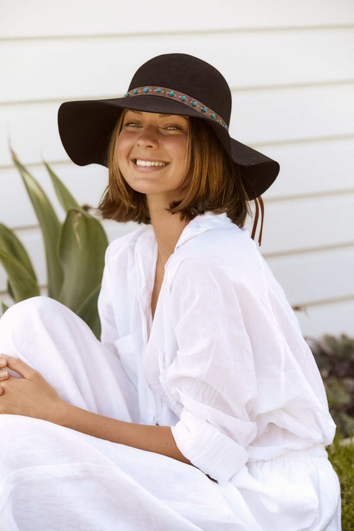 Girl sitting in Black Wool Boho floppy Hat Women's Hat smiling