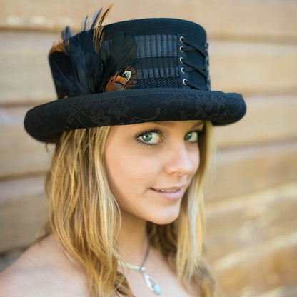 Woman with big pretty eyes wearing Victorian wool steampunk top hat in Black with lace under brim